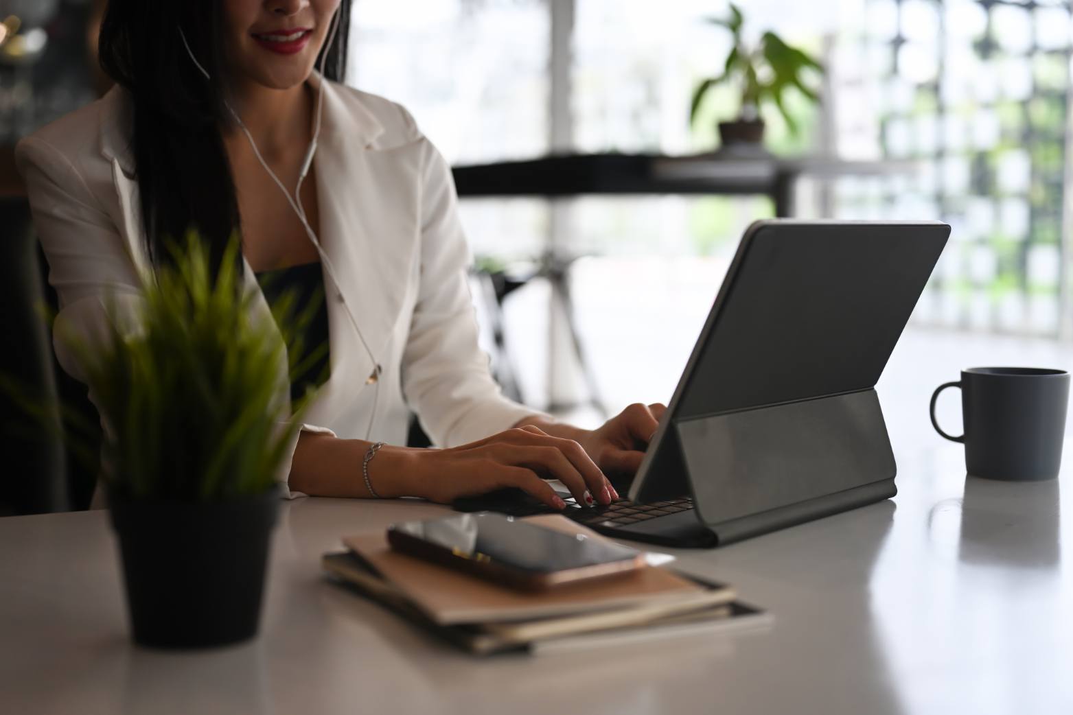 cropped-shot-of-businesswoman-wearing-earphone-and-2023-11-27-05-25-55-utc